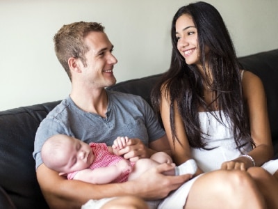 Young couple with their newborn baby.