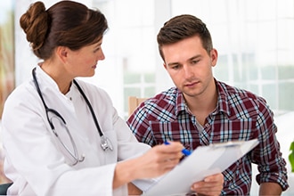 Doctor reviewing information with a patient.