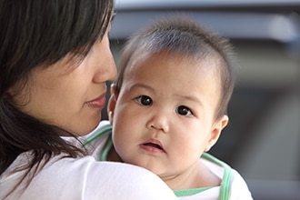 Woman holding her baby.